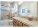 Bathroom with tile walls, a shower, and a vanity, providing a functional space for daily routines at 8248 E Arroyo Hondo Rd, Scottsdale, AZ 85266