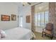 Comfortable bedroom with a cozy bed, window with shutters, and stylish decor for a peaceful retreat at 8248 E Arroyo Hondo Rd, Scottsdale, AZ 85266