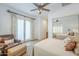 Bedroom with sitting area, French doors, large windows and mirrored closet at 8248 E Arroyo Hondo Rd, Scottsdale, AZ 85266