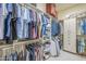 Organized walk-in closet with ample hanging space, shelving, and storage, keeping everything tidy and accessible at 8248 E Arroyo Hondo Rd, Scottsdale, AZ 85266