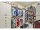 Organized walk-in closet with ample shelving, drawers, and storage for clothing, shoes, and accessories at 8248 E Arroyo Hondo Rd, Scottsdale, AZ 85266