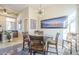 Dining area featuring a round table, stylish chairs, and decorative lighting, perfect for Gathering meals at 8248 E Arroyo Hondo Rd, Scottsdale, AZ 85266