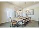 This expansive dining room features a long table with seating for ten and custom light fixtures at 8248 E Arroyo Hondo Rd, Scottsdale, AZ 85266