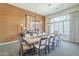 This expansive dining room features a long table with seating for ten and an art piece that really brings the room together at 8248 E Arroyo Hondo Rd, Scottsdale, AZ 85266