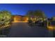 Attractive home exterior featuring a paved driveway and well-manicured desert landscaping at 8248 E Arroyo Hondo Rd, Scottsdale, AZ 85266