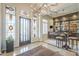Grand foyer featuring custom bar area, and decorative lighting at 8248 E Arroyo Hondo Rd, Scottsdale, AZ 85266