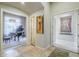 Hallway with access to music room featuring a grand piano and decorative painting at 8248 E Arroyo Hondo Rd, Scottsdale, AZ 85266