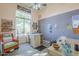 Bright hobby room with ample natural light, crafting tables, and storage at 8248 E Arroyo Hondo Rd, Scottsdale, AZ 85266