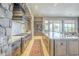 Open kitchen with stainless steel appliances, granite countertops and large island at 8248 E Arroyo Hondo Rd, Scottsdale, AZ 85266