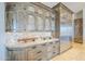 Kitchen details include custom wood cabinetry, decorative backsplash, granite countertops, and stainless steel refrigerator at 8248 E Arroyo Hondo Rd, Scottsdale, AZ 85266