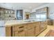 Kitchen island featuring stainless steel appliances and custom wood cabinetry at 8248 E Arroyo Hondo Rd, Scottsdale, AZ 85266