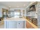 Open kitchen featuring stainless steel appliances and custom wood cabinetry at 8248 E Arroyo Hondo Rd, Scottsdale, AZ 85266