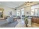 Open living area features a wet bar, comfortable seating, and bright natural light at 8248 E Arroyo Hondo Rd, Scottsdale, AZ 85266