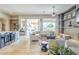 Open floor plan with living room, breakfast bar, and an indoor/outdoor living space at 8248 E Arroyo Hondo Rd, Scottsdale, AZ 85266
