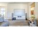 Living room with comfortable seating, and a large screen, offering a perfect blend of relaxation and entertainment at 8248 E Arroyo Hondo Rd, Scottsdale, AZ 85266