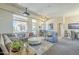 Bright and airy living space with comfortable seating, a wet bar, and dining area, perfect for modern living at 8248 E Arroyo Hondo Rd, Scottsdale, AZ 85266