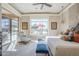Bright bedroom features a seating area, large window with outdoor view, and plush furnishings at 8248 E Arroyo Hondo Rd, Scottsdale, AZ 85266