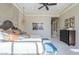 Well-appointed main bedroom with beautiful headboard, neutral walls and carpet, and contemporary lighting at 8248 E Arroyo Hondo Rd, Scottsdale, AZ 85266