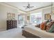 Spacious main bedroom with neutral walls, plush carpet, and large windows overlooking the patio at 8248 E Arroyo Hondo Rd, Scottsdale, AZ 85266