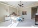 Spacious bedroom with soft carpet, neutral tones, stylish lighting, and decorative wall art at 8248 E Arroyo Hondo Rd, Scottsdale, AZ 85266