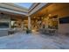 Spacious outdoor patio featuring built in BBQ, stone floors, and a dining area at 8248 E Arroyo Hondo Rd, Scottsdale, AZ 85266