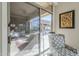View of covered patio through sliding glass door, showcasing an inviting outdoor living space at 8248 E Arroyo Hondo Rd, Scottsdale, AZ 85266