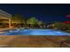 Inviting backyard pool featuring desert landscaping and clear night sky at 8248 E Arroyo Hondo Rd, Scottsdale, AZ 85266