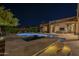 Backyard pool and spa with red umbrellas and covered patio with exterior television, perfect for outdoor entertainment at 8248 E Arroyo Hondo Rd, Scottsdale, AZ 85266