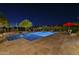 Luxurious pool and spa with accent lighting and lush desert landscaping in the backyard at 8248 E Arroyo Hondo Rd, Scottsdale, AZ 85266