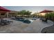 Beautiful backyard pool and patio area with lounge chairs and umbrellas for relaxing outdoors at 8248 E Arroyo Hondo Rd, Scottsdale, AZ 85266