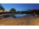 Relaxing pool and spa with lounge chairs and shade umbrellas amidst desert landscape at 8248 E Arroyo Hondo Rd, Scottsdale, AZ 85266