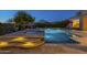 Inviting pool and spa combination with stylish tile and stone surround, perfect for relaxing evenings at 8248 E Arroyo Hondo Rd, Scottsdale, AZ 85266