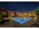 Gorgeous backyard pool with outdoor kitchen and lounging area, ideal for entertaining at 8248 E Arroyo Hondo Rd, Scottsdale, AZ 85266