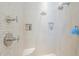 Shower with dual shower heads, a built in bench, and tiled niches at 8248 E Arroyo Hondo Rd, Scottsdale, AZ 85266