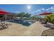 A refreshing in-ground pool surrounded by lush vegetation and desert views at 8248 E Arroyo Hondo Rd, Scottsdale, AZ 85266