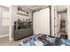 The bedroom features built-in shelves and barn closet door, decorated with toys and Star Wars bedding at 850 W Folley St, Chandler, AZ 85225