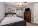 Cozy bedroom featuring a bed with white linens and a dark wood dresser at 850 W Folley St, Chandler, AZ 85225