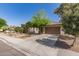 Charming home with a well-maintained front yard, desert landscaping, and a two-car garage at 850 W Folley St, Chandler, AZ 85225