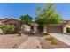 Charming single-Gathering home featuring a stone facade, manicured landscaping and a brick pathway at 850 W Folley St, Chandler, AZ 85225