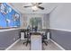 Well-lit home office featuring a world map wall decoration, dual workstations, and sleek modern furniture at 850 W Folley St, Chandler, AZ 85225