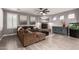 Spacious living room featuring modern decor, a cozy fireplace, and stylish wood-look flooring at 850 W Folley St, Chandler, AZ 85225