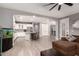 Open-concept living space featuring a modern kitchen with white cabinetry and a comfortable living area at 850 W Folley St, Chandler, AZ 85225