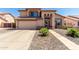Charming two-story home featuring neutral stucco, manicured landscaping, and a two-car garage at 8555 W Purdue Ave, Peoria, AZ 85345