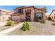 Charming two-story home with a well-manicured yard and an inviting entrance, showcasing great curb appeal at 8555 W Purdue Ave, Peoria, AZ 85345