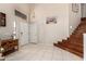 Elegant foyer with tile flooring, a staircase, and high ceilings creating a grand entrance at 8555 W Purdue Ave, Peoria, AZ 85345