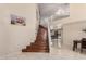 Grand foyer features hardwood stairs, tile flooring, and soaring ceilings at 8555 W Purdue Ave, Peoria, AZ 85345