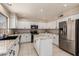 Bright kitchen featuring granite countertops, stainless steel appliances, and white cabinets and island at 8555 W Purdue Ave, Peoria, AZ 85345