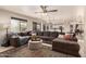 Inviting living room with comfortable seating and an open view into the modern kitchen at 8555 W Purdue Ave, Peoria, AZ 85345