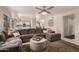 Open-concept living room offering a comfortable space and a seamless flow into the kitchen at 8555 W Purdue Ave, Peoria, AZ 85345