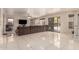 Comfortable living room featuring a plush sofa and easy access to the outdoor patio at 8555 W Purdue Ave, Peoria, AZ 85345